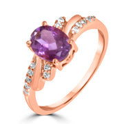 Rose gold ring with a purple gemstone and small diamonds on a white background